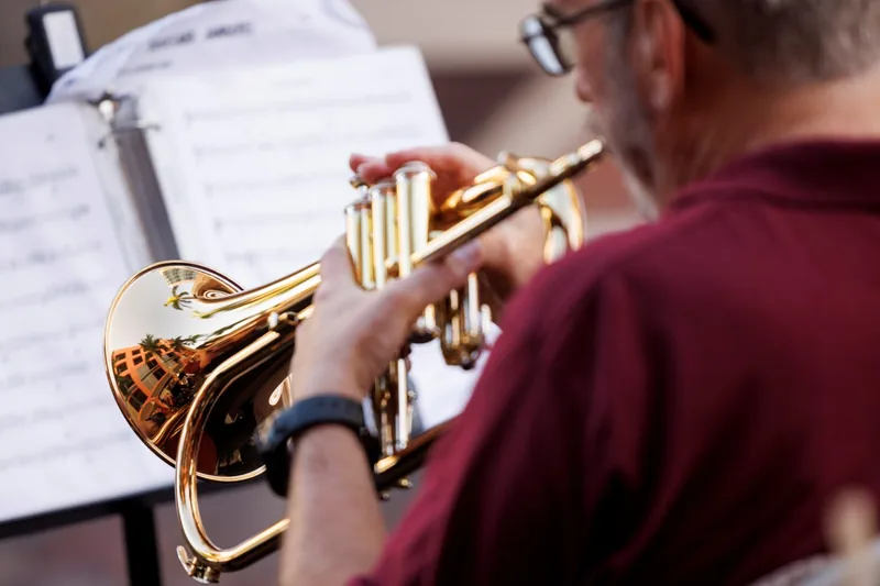 Trumpet player performing at the Fort Myers River District Music Walk