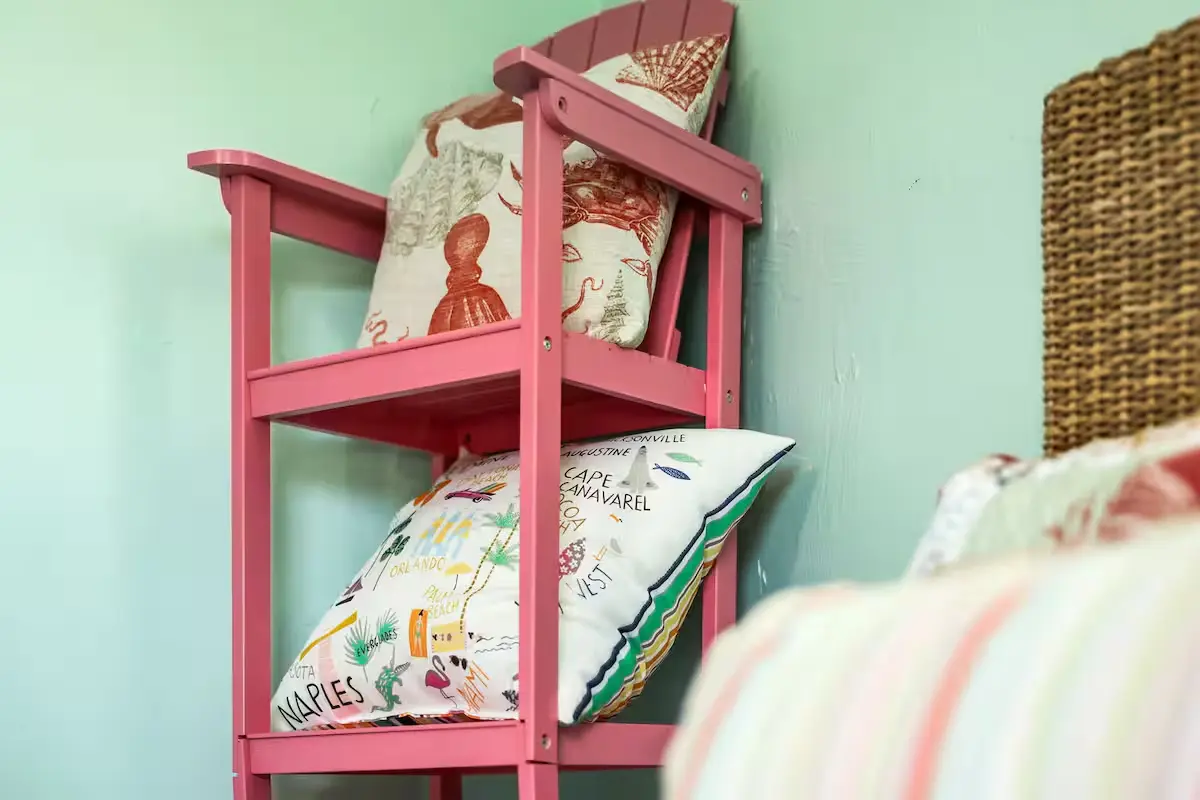 Twin bedroom with colorful shelving