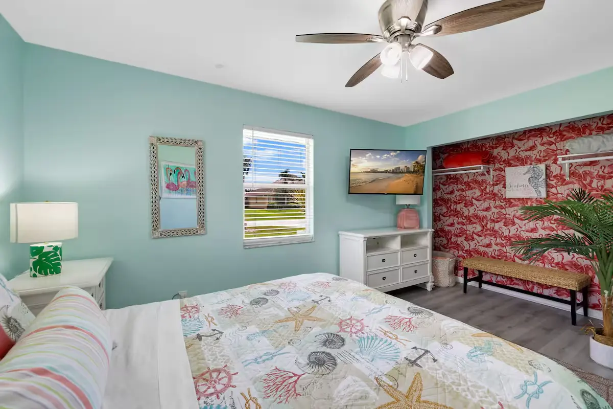 Bedroom with mural wall and coastal bedding