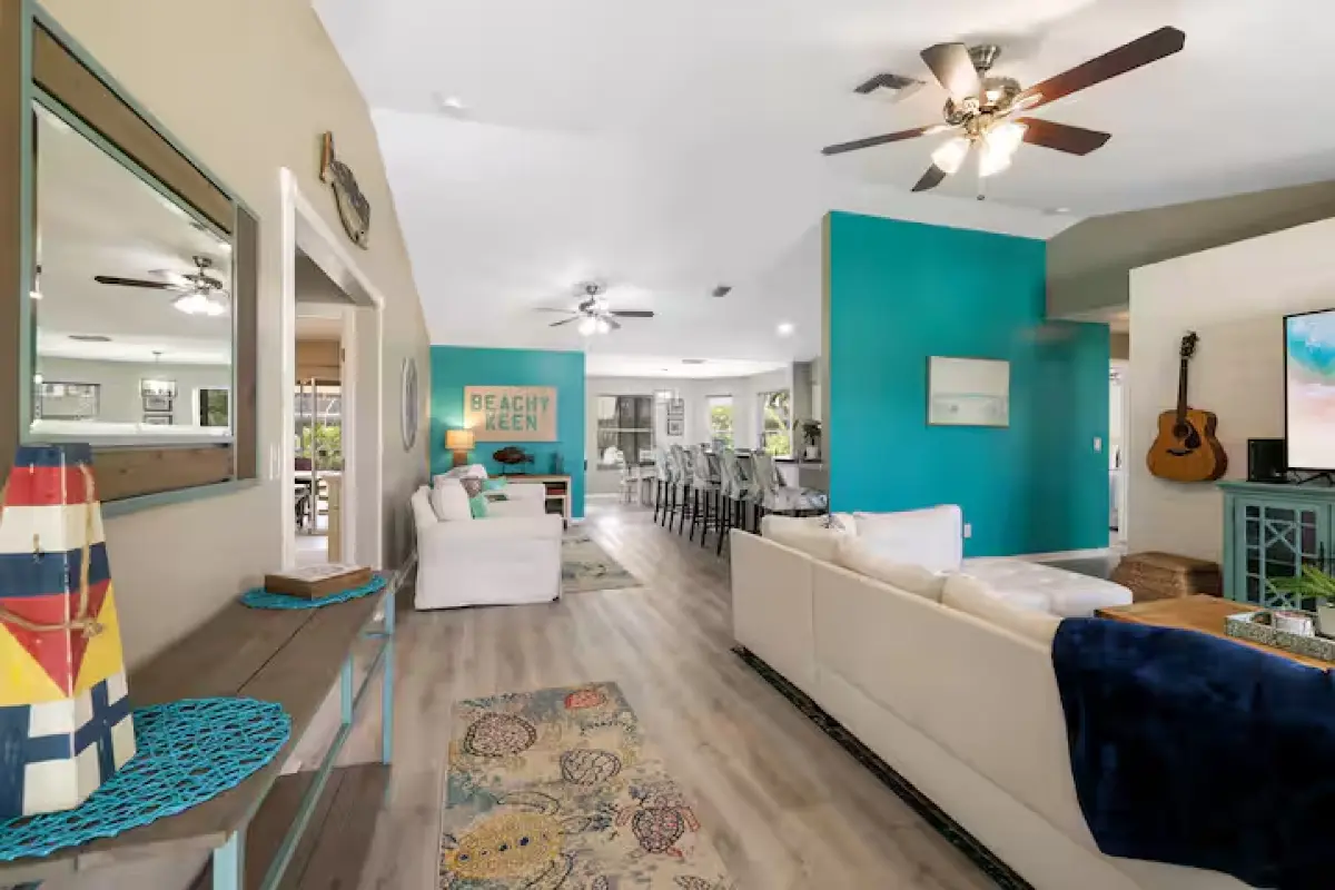 Open living room with teal accents