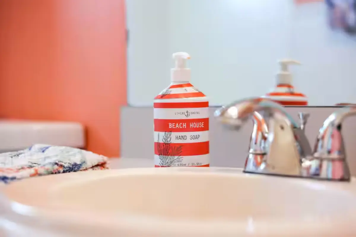 Bathroom with coral accent wall