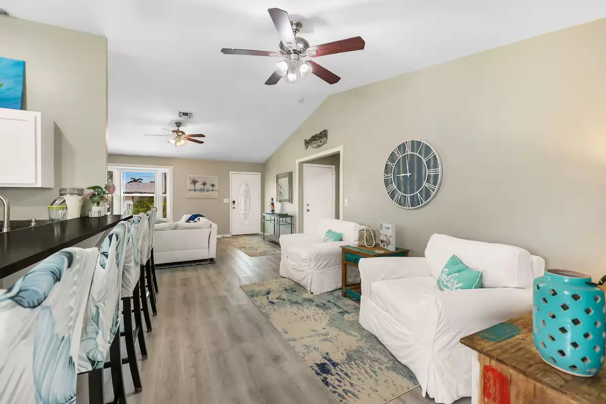 Bright open living room and kitchen bar seating