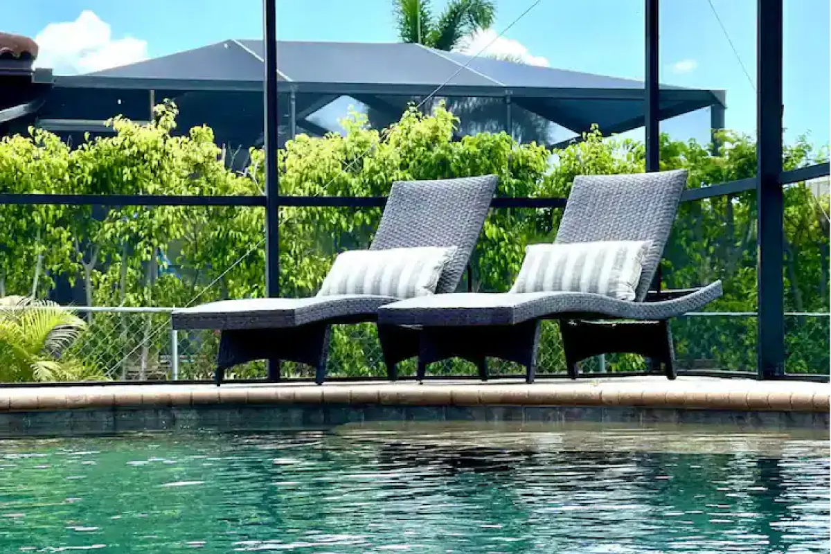Sun loungers beside the heated pool