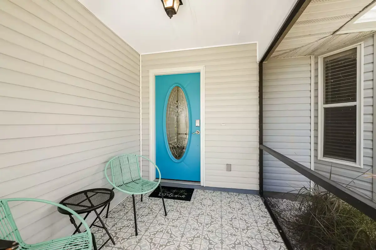 Lanai with teal door and seating