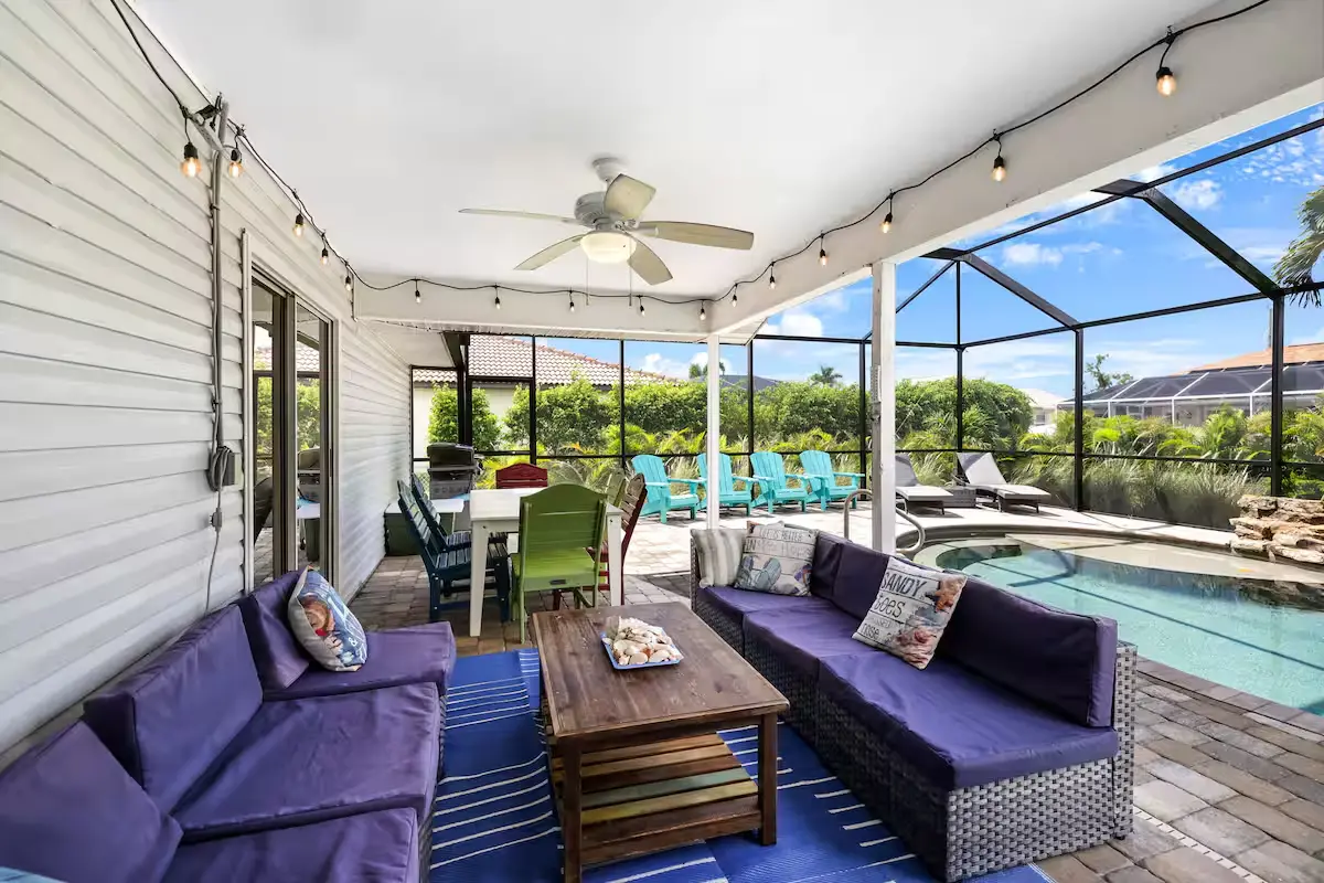 Screened lanai lounge overlooking the pool
